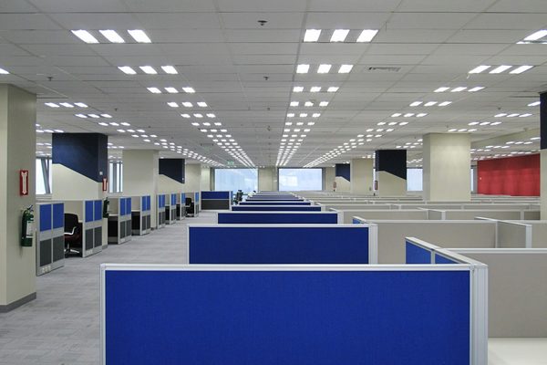 Finished suspended grid ceiling in an open-plan office
