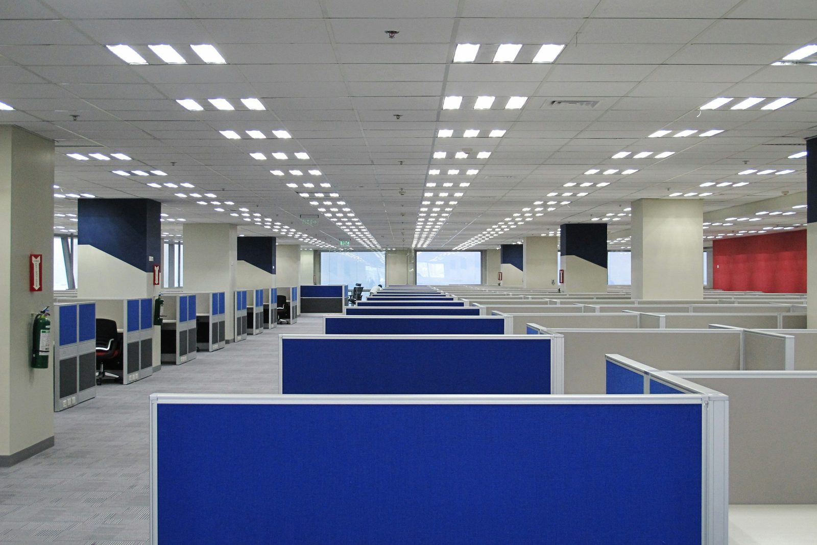 Finished suspended grid ceiling in an open-plan office